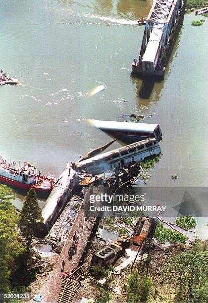 Portion the Sunset Limited, an Amtrak express train running from Los Angeles to Miami, lies partially submerged in a bayou about eight miles north of...