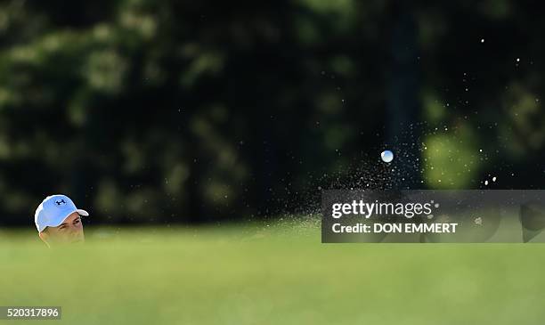 Golfer Jordan Spieth hits out of a bunker on the 17th hole during Round 4 of the 80th Masters Golf Tournament at the Augusta National Golf Club on...