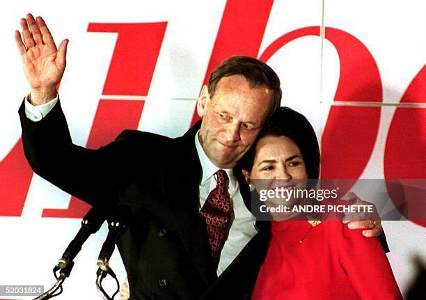 Canadian Prime Minister designate Jean Chretien and his wife Aline acknowledge supporters 26 October 1993 at the Liberal Party's headquarters in...