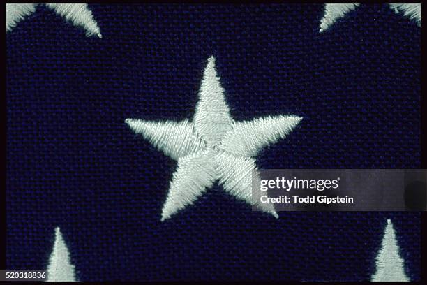 close-up of embroidered star on flag - embroidery fotografías e imágenes de stock