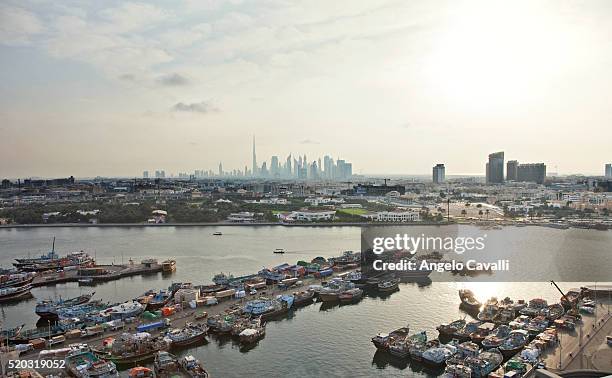 dhows on dubai creek - dhow dubai stock pictures, royalty-free photos & images
