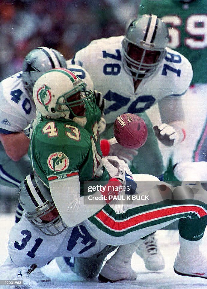 Miami Dolphin running back Terry Kirby (43) loses