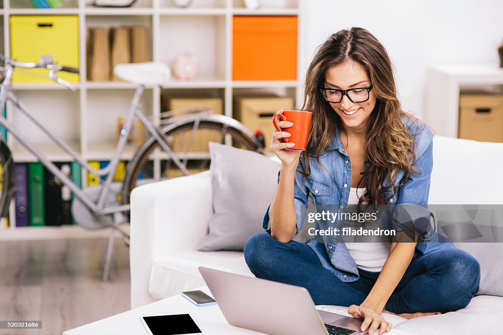 Woman Using Laptop At Home