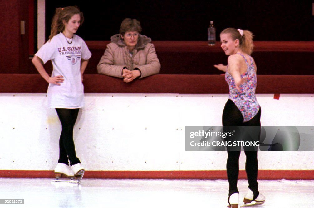 U.S. figure skater Tonya Harding (R) skates near m