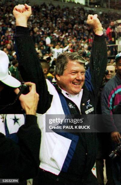 Dallas Cowboys head coach Jimmy Johnson celebrates his team's win over the San Francisco 49ers during the last seconds of the game, 23 January 1994....