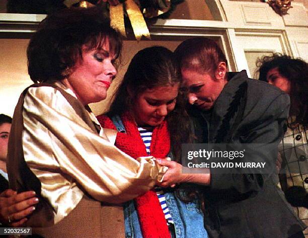 Alina Fernandez Revuelta , daughter of Cuban leader Fidel Castro, and her daughter Alina-Maria Salgado-Fernandez share a moment of thanks with their...