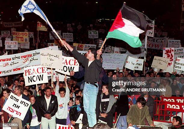 Thousands of Israeli Jews and Arabs demonstrate 05 March 1995, protesting the Hebron massacre. The first joint Jewish-Arab demonstration was...