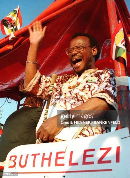 Zulu nationalist leader Mangosuthu Buthelezi waves to a crowd of some 15,000 supporters during his last-minute election campaign into the heartland...