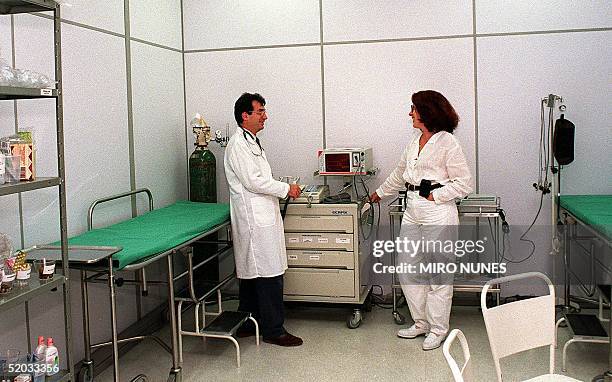 Doctor David Kestemberg gives instructions to a nurse 22 June 1999 in the central medical office in the Museum of Modern Art. El Doctor David...