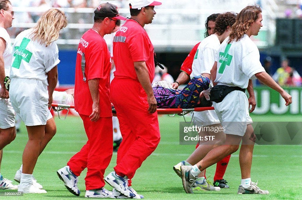 Moroccan goal keeper Khalil Azmi is carried from t