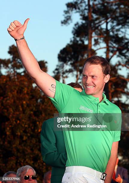 Danny Willett of England celebrates winning during the green jacket ceremony after the final round of the 2016 Masters Tournament at Augusta National...