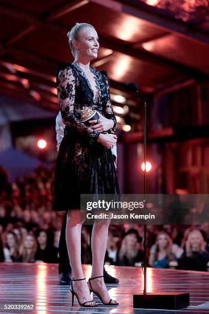 Actress Charlize Theron accepts Best Female Performance for 'Mad Max: Fury Road' onstage during the 2016 MTV Movie Awards at Warner Bros. Studios on...