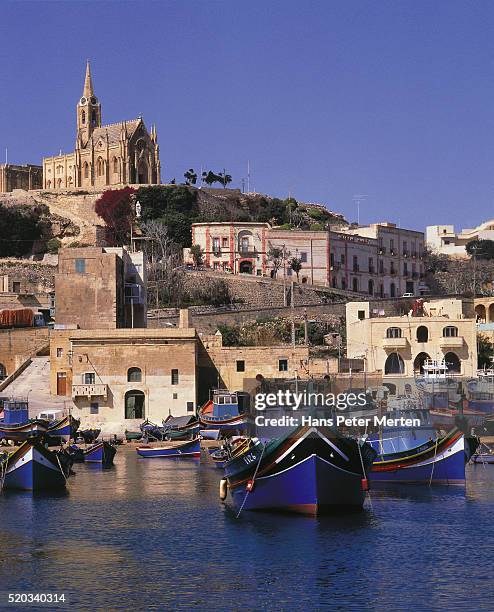 look at fishing boats and church on the hill, gozo, malta - mgarr harbour stock pictures, royalty-free photos & images
