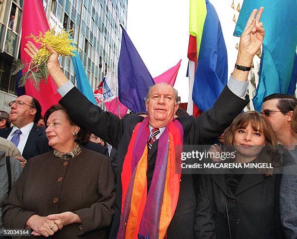 Chilean presidential candidate for a coalition of various leftist parties, Ricardo Lagos, waves to supporters in downtown Santiago 12 August 1999...