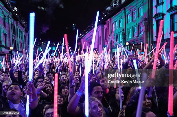 Fans wave 'Star Wars: The Force Awakens' lightsabers during the 2016 MTV Movie Awards at Warner Bros. Studios on April 9, 2016 in Burbank,...