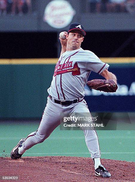 Atlanta Braves pitcher Greg Maddux delivers a pitch against the Cincinnati Reds in Cincinnati, OH 31 August 1999. The Braves defeated the Reds, 8-2.