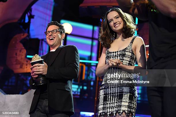 Director J.J. Abrams and actress Daisy Ridley accept the Movie of the Year award for 'Star Wars: The Force Awakens' onstage during the 2016 MTV Movie...