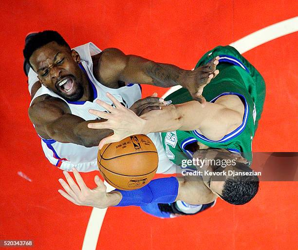 Jeff Green of the Los Angeles Clippers has his layup blocked by Salah Mejri of the Dallas Mavericks during the first half of the basketball game at...