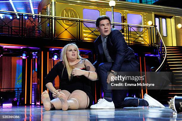Actress Rebel Wilson and actor Adam DeVine kiss while accepting the Best Kiss award for 'Pitch Perfect 2' onstage during the 2016 MTV Movie Awards at...