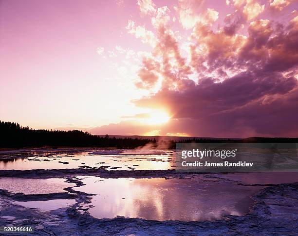 sunset at great fountain geyser - great fountain geyser stock pictures, royalty-free photos & images