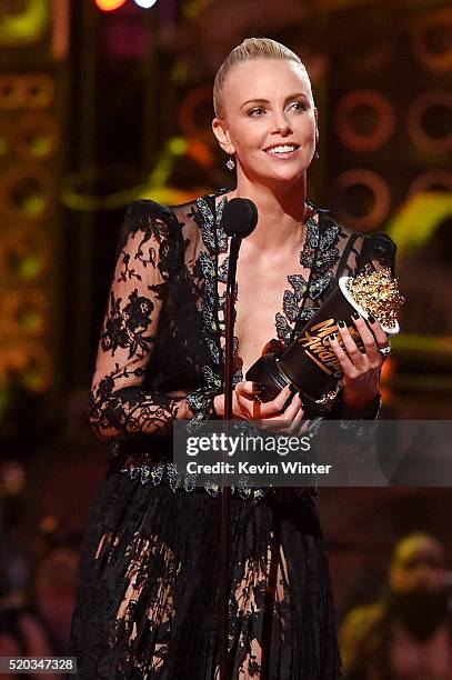 Actress Charlize Theron accepts Best Female Performance for 'Mad Max: Fury Road' onstage during the 2016 MTV Movie Awards at Warner Bros. Studios on...