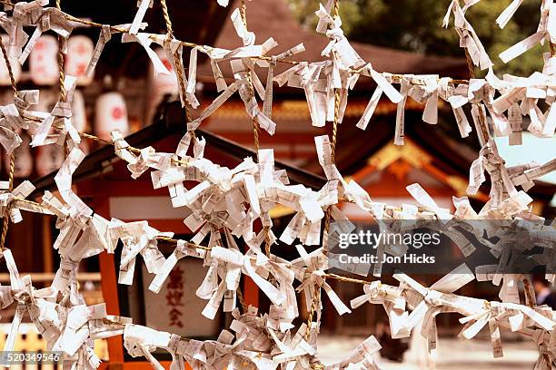 prayers tied at yasaka jinja temple - yasaka shrine stock pictures, royalty-free photos & images