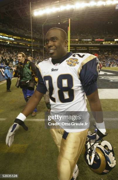 Running back Marshall Faulk of the St. Louis Rams walks off the field after his team defeated the Seattle Seahawks in the NFC wild-card game at Qwest...