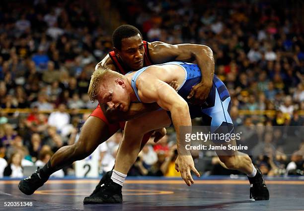 Den Cox and Kyle Dake compete in their 85kg freestyle match on day 2 of the 2016 U.S. Olympic Team Wrestling Trials at Carver-Hawkeye Arena on April...