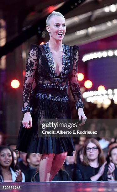 Actress Charlize Theron accepts award for best female performance "Mad Max: Fury Road" onstage during the 2016 MTV Movie Awards at Warner Bros....