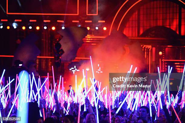 Fans wave 'Star Wars: The Force Awakens' lightsabers during the 2016 MTV Movie Awards at Warner Bros. Studios on April 9, 2016 in Burbank,...