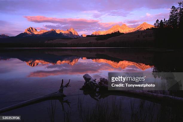 sawtooth mountains reflected in little redfish lake - redfish lake stock pictures, royalty-free photos & images