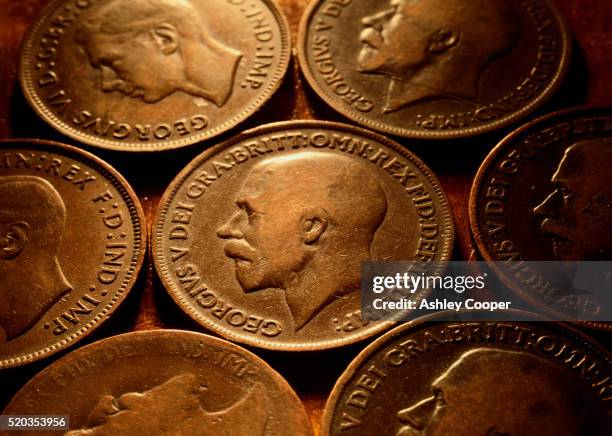 old british pennies - george v of great britain stock pictures, royalty-free photos & images