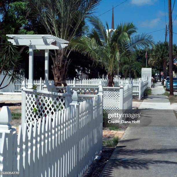 white picket fence and sidewalk - white picket gate stock pictures, royalty-free photos & images
