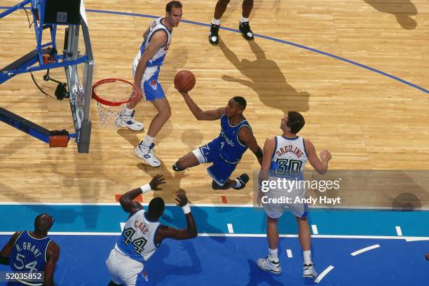 Anfernee Hardaway of the Orlando Magic drives to the basket for a layup against the Cleveland Cavaliers during the NBA game on January 11, 1995 in...