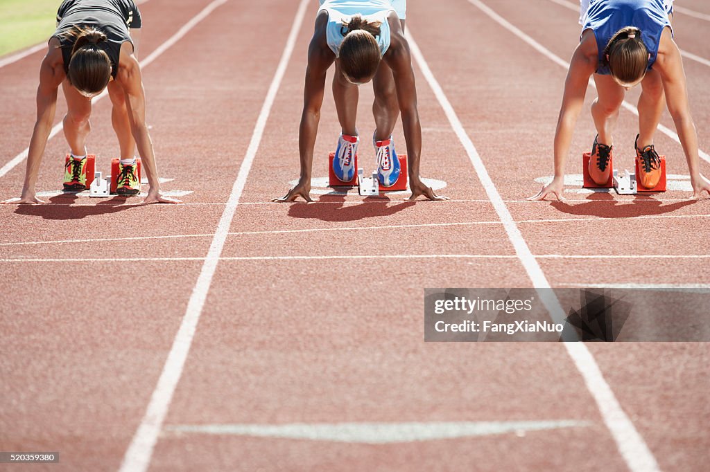 Runners in starting blocks