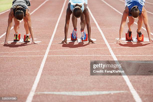 runners in starting blocks - athlete stock pictures, royalty-free photos & images