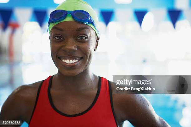 swimmer portrait - african woman swimming stock pictures, royalty-free photos & images