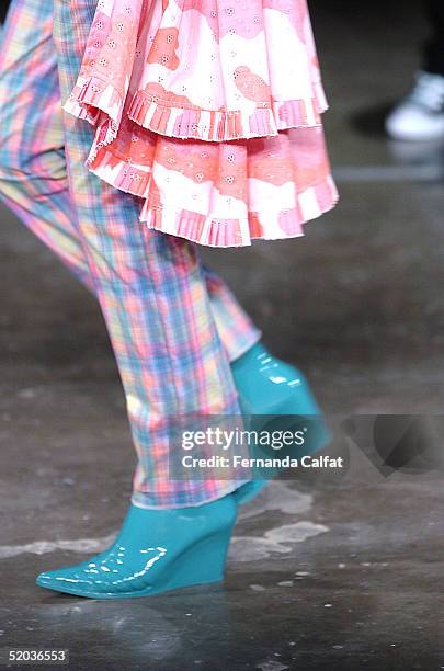 Model Raquel Lieven presents a creation by designer Alexandre Herchcovitch during the Fall/Winter 2005 collection of the Sao Paulo Fashion Week at...