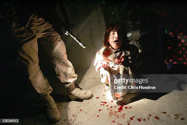 Samar Hassan screams after her parents were killed by U.S. Soldiers with the 25th Infantry Division in a shooting January 18, 2005 in Tal Afar, Iraq....