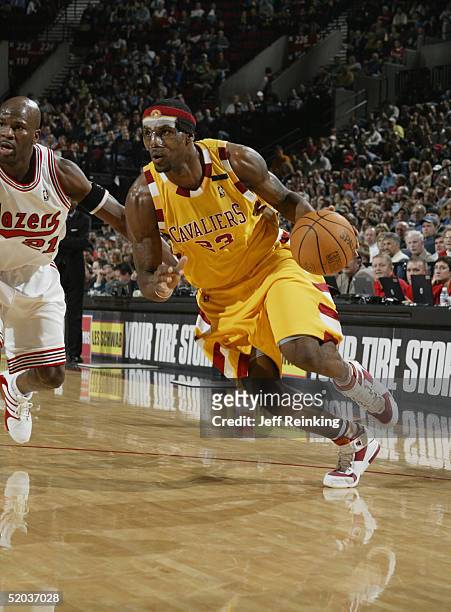 LeBron James of the Cleveland Cavaliers drives past Ruben Patterson of the Portland Trail Blazers January 19, 2005 at the Rose Garden in Portland,...