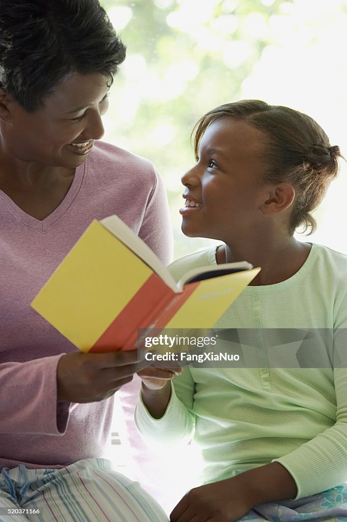 Mother reading with her daughter