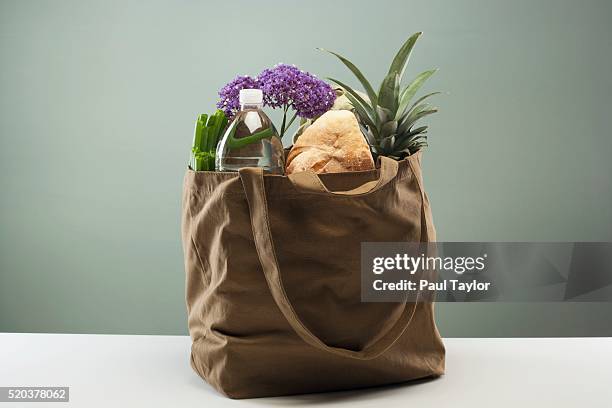 groceries in tote bag - tote bags stock pictures, royalty-free photos & images