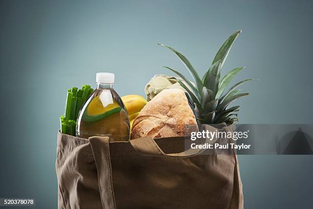 groceries in tote bag - saco tote imagens e fotografias de stock