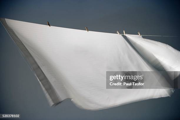 bed sheet drying on clothesline - sheets on clothesline stock pictures, royalty-free photos & images