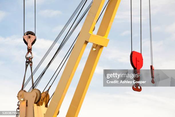 a crane for heavy lifting at duco ltd - crane photos et images de collection