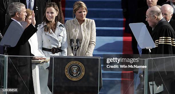 President George W. Bush takes the oath of office from U.S. Supreme Court Chief Justice William Rehnquist during inaugural ceremonies with first lady...