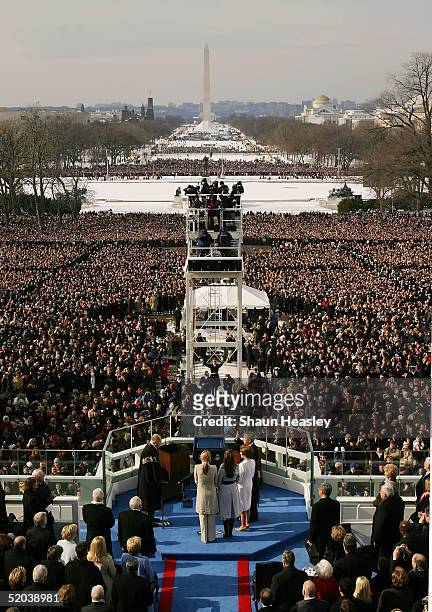 President George W. Bush takes the oath of office from U.S. Supreme Court Chief Justice William Rehnquist during inaugural ceremonies with first lady...