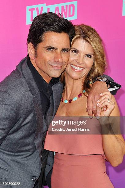 John Stamos and Lori Loughlin arrive at the TV Land Icon Awards at The Barker Hanger on April 10, 2016 in Santa Monica, California.