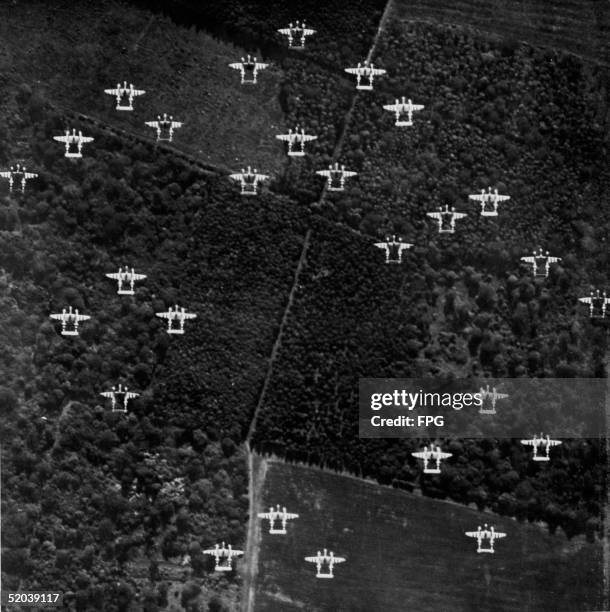 Squadron of Lockheed P-38 Lightnings, under the command of Lt. Col. Clarence Shoop, fly across the English countryside on their way to France on...