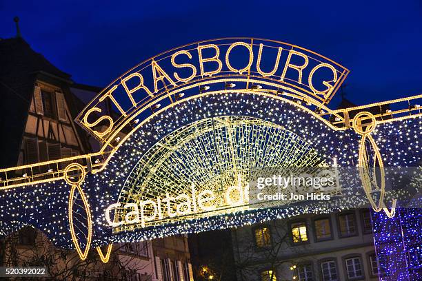 lighted sign at strasbourg christmas market - strasbourg fotografías e imágenes de stock